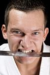 Karate, Sword In His Mouth Stock Photo