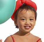 Kid Celebrating With Balloons Stock Photo