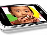 Kid Eating Donut On Mobile Screen Stock Photo