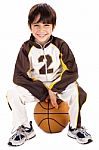 Kid Stylishly Sitting On The Ball Stock Photo