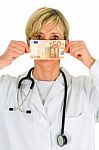 Lady Doctor Showing Money Stock Photo