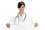 Lady Doctor Standing With Placard Stock Photo