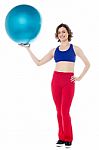 Lady Gym Instructor Holding Pilates Ball Stock Photo
