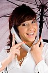 lady Talking On Phone with Umbrella Stock Photo
