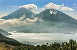 Landscape Of Volcanoes Surrounding Lake Atitlan In Guatemala Stock Photo