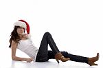 Laying Girl Wearing Christmas Hat Stock Photo