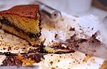 Leftover Cake With Chocolate Cream And Crumbs Stock Photo