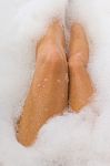 Legs Of Female In The Bathtub Stock Photo
