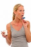 Licking Yogurt Pot Lid Stock Photo