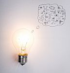 Light Bulb With Drawing Graph Stock Photo
