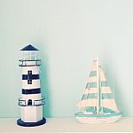 Lighthouse And Ship Model For Decorated Stock Photo