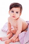 Little Baby Bending Down And Covered With Towel Stock Photo
