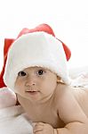 Little Baby Wearing Santa Cap Stock Photo