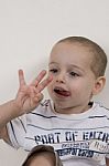 Little boy counting his fingers Stock Photo
