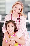 Little Cheerful Girl Visiting The Doctor  Stock Photo