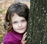 Little Girl By Tree Stock Photo