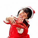 Little Girl Dressed As Santa Claus Stock Photo