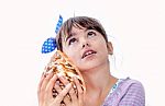 Little Girl Holding A Sea Shell Stock Photo