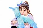 Little Girl Holding Blue Unicorn Toy Isolated On White Stock Photo