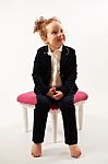 Little Girl In Black Suit Stock Photo