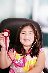 Little Girl Playing Doctor With Stethoscope Stock Photo