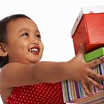 Little Girl Receiving Gifts Stock Photo