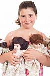 Little Girl With Dolls Stock Photo