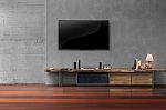 Living Room Led Tvs On Concrete Wall With Wooden Table Media Fur Stock Photo