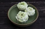 Lotus Flower Floating In Green Bowl Stock Photo