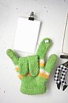 Love Sign , Photo Blank With Green Knitted Gloves On White Broad Stock Photo