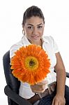 Lovely Girl Showing Orange Gerbera Flower Stock Photo