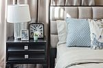 Luxury Bedroom With Lamp And Alarm Clock On Wooden Table Stock Photo