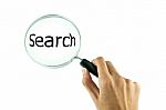 Magnifying Glass In Hand Stock Photo