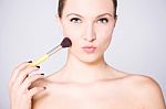Make Up  Woman Using Blusher Brush Stock Photo