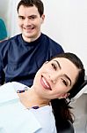 Male Dentist Ready To Examine The Patient Stock Photo
