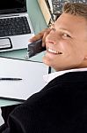 Male Executive Talking Over Phone Stock Photo