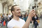 male Photographer With Smartphone Stock Photo