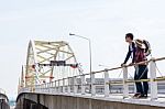 Male Tourists Enjoy The Bridge Stock Photo