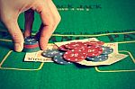 Man Betting On Poker Stock Photo