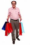 Man Carrying Shopping Bags Stock Photo