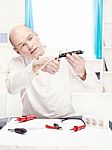 Man Doing Minor Repair At Home Stock Photo