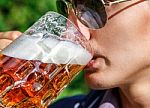 Man Drinking Beer From Mug Closeup Stock Photo
