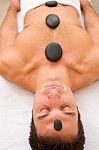 Man Getting A Massage With Hot Stones Stock Photo