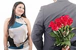 Man Hiding Bunch Of Red Roses Behind His Back To Surprise His Gi Stock Photo