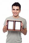 Man Holding Frame Stock Photo