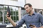 Man Holding I-pad Tablet Computer Stock Photo