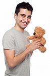 Man Holding Teddy Bear Stock Photo