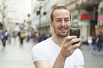 Man In Street With Cell Phone Stock Photo