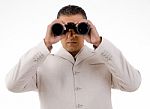 Man Looking Through Binocular Stock Photo