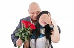 Man Offering A Bouquet Of Red Roses To A Woman Stock Photo